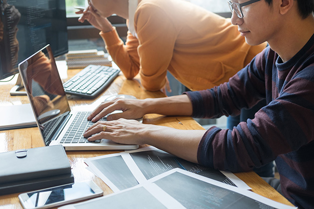 Software designer working on project in IT company office